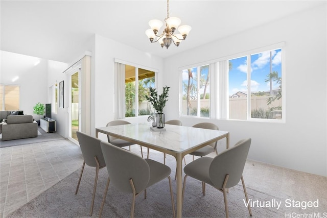 dining area featuring an inviting chandelier