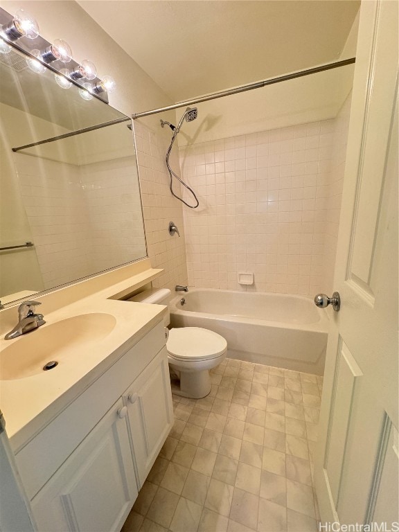 full bathroom with vanity, toilet, and tiled shower / bath