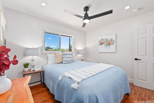 bedroom featuring ceiling fan and dark hardwood / wood-style floors