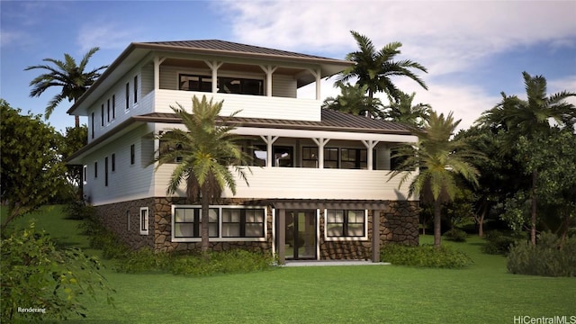 rear view of property featuring a balcony and a yard