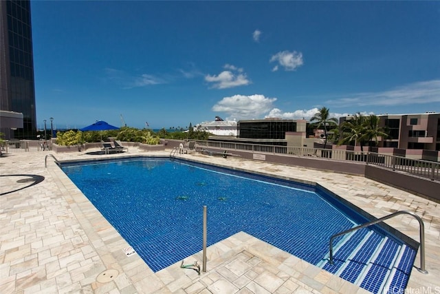 view of swimming pool with a patio area