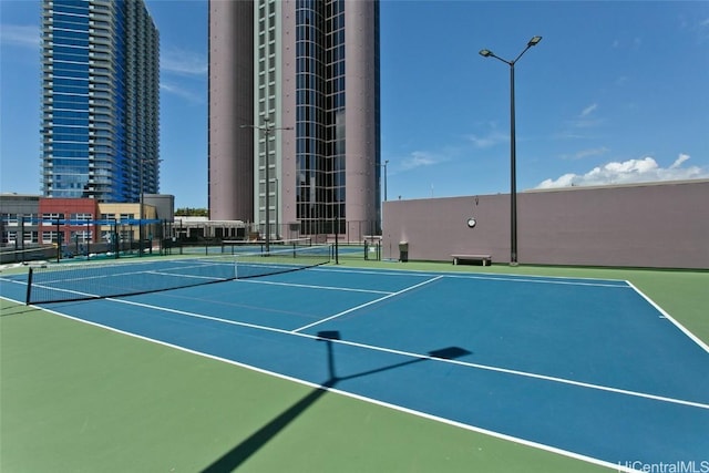 view of sport court with basketball hoop