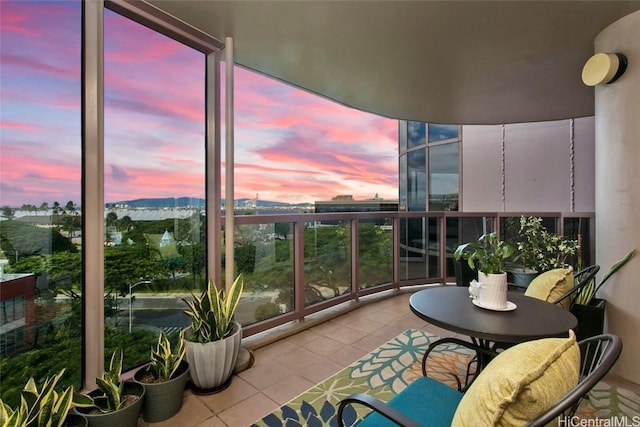 view of balcony at dusk