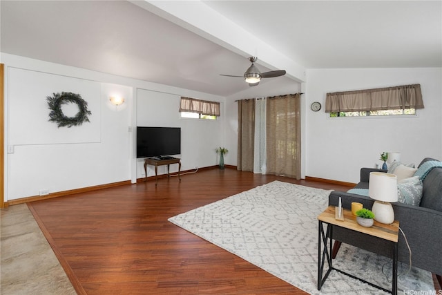 living room featuring baseboards, vaulted ceiling, wood finished floors, and a ceiling fan