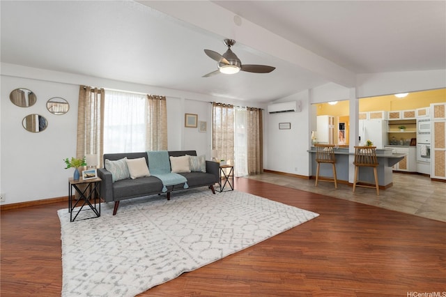 living room featuring vaulted ceiling with beams, wood finished floors, a wall mounted AC, and ceiling fan