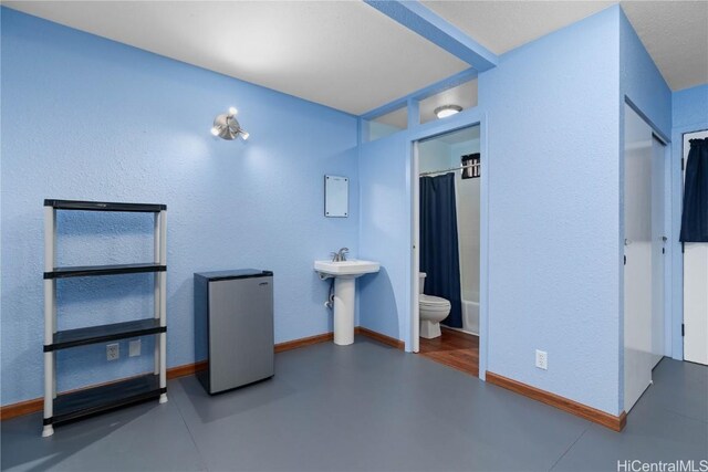 bathroom with toilet and shower / bath combo