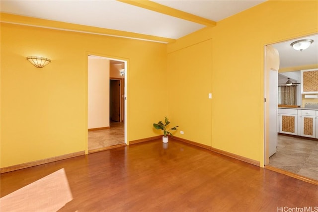 empty room with hardwood / wood-style flooring