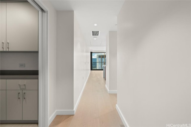 corridor featuring light hardwood / wood-style flooring