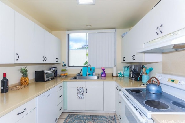 kitchen featuring white electric range oven, light tile patterned floors, white cabinets, and sink