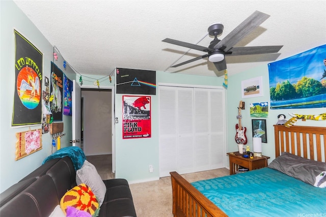 6770 Hawaii Kai Dr Unit 24, Honolulu, HI 96825 - carpeted bedroom featuring a closet, a textured ceiling, and a ceiling fan