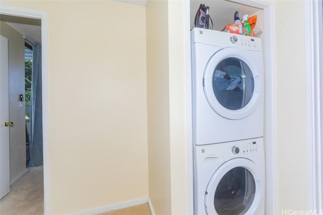 laundry area featuring stacked washer and dryer