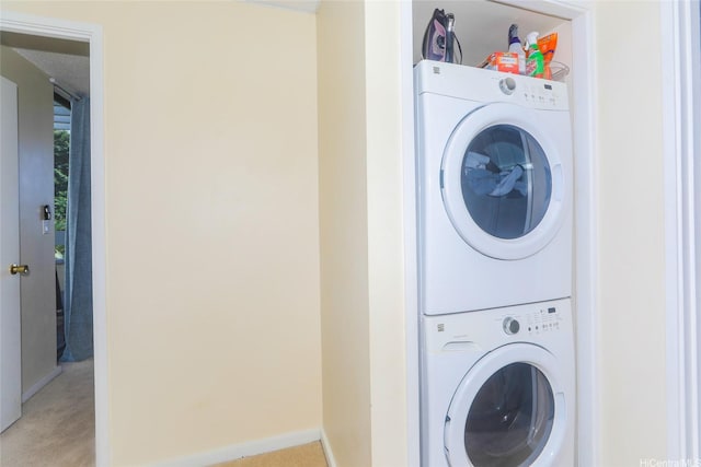 6770 Hawaii Kai Dr Unit 24, Honolulu, HI 96825 - laundry room featuring estacked washer and dryer and light colored carpet