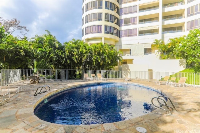 view of pool featuring a patio area