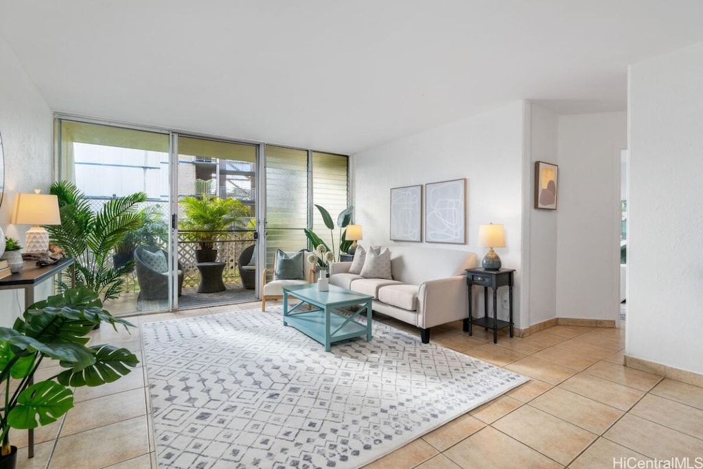 living room featuring floor to ceiling windows and light tile patterned floors