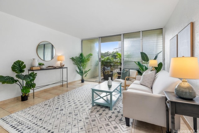 living room featuring a wall of windows and light tile patterned floors