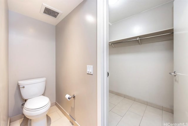 bathroom featuring tile patterned floors and toilet