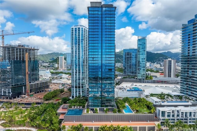 property's view of city featuring a mountain view