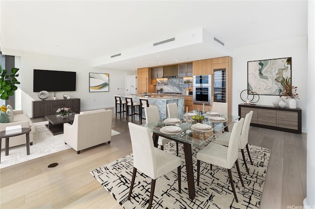 1100 Ala Moana Blvd Unit 600, Honolulu, HI 96814 - dining room featuring light wood-type flooring and recessed lighting