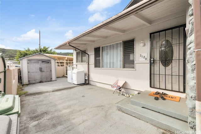 view of patio / terrace featuring a storage unit