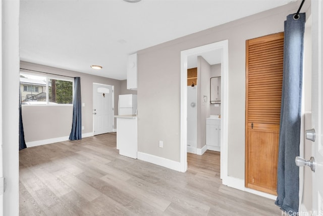 unfurnished living room with light hardwood / wood-style floors