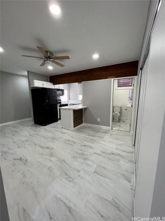 kitchen with black appliances, ceiling fan, white cabinets, and kitchen peninsula