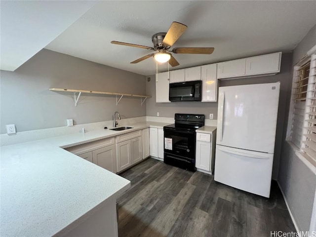 kitchen with dark wood-type flooring, black appliances, white cabinets, sink, and kitchen peninsula