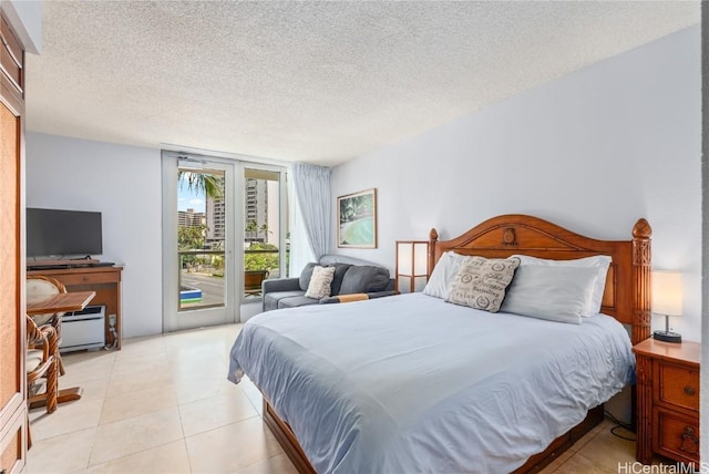 tiled bedroom with access to exterior and a textured ceiling