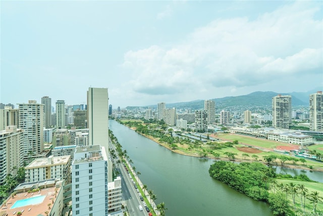 birds eye view of property featuring a water and mountain view and a view of city