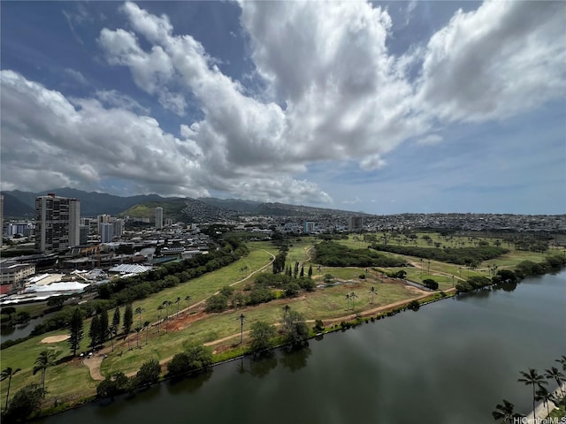 birds eye view of property with a water view and a city view