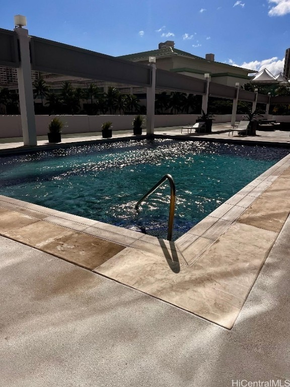 view of pool featuring a patio area