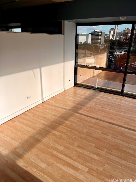 spare room featuring light hardwood / wood-style flooring