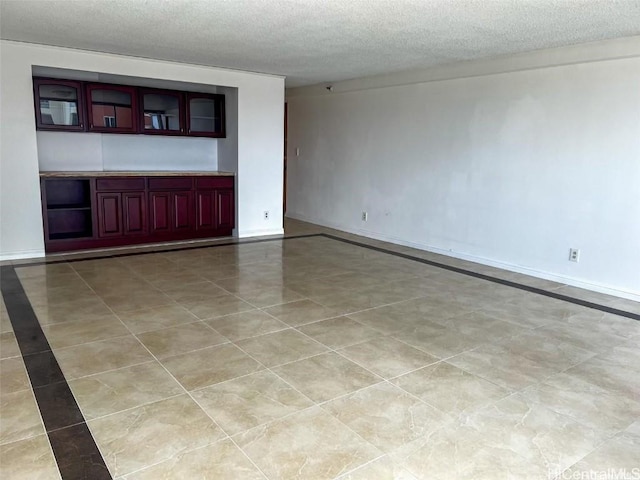 unfurnished living room with a textured ceiling