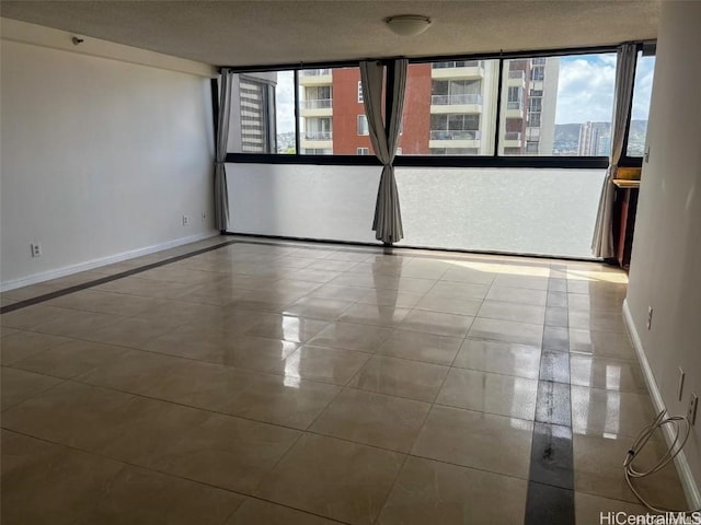 spare room featuring tile patterned flooring