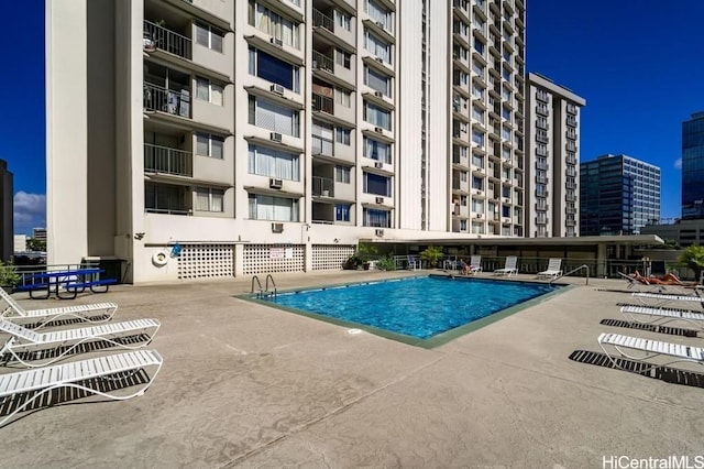 view of swimming pool with a patio area