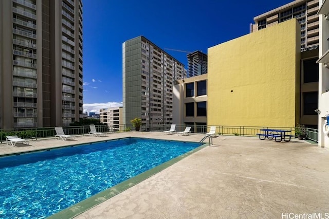 view of swimming pool with a patio