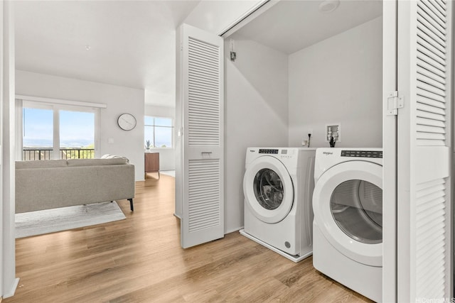 91-3575 Iwikuamoo St Unit 501, Ewa Beach, HI 96706 - washroom with separate washer and dryer and light wood finished floors