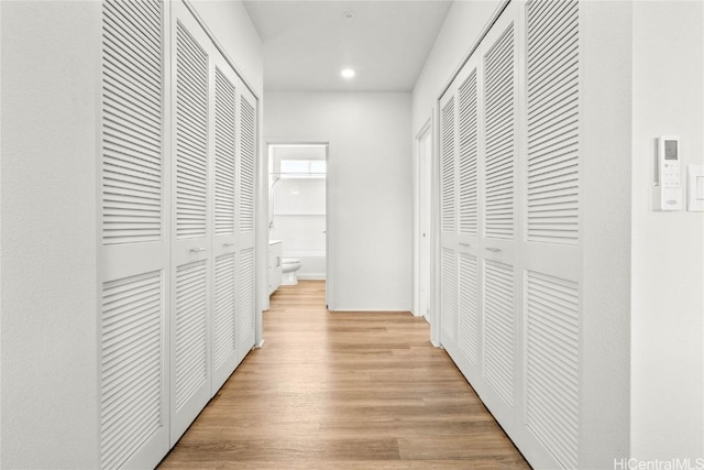 corridor featuring light hardwood / wood-style flooring