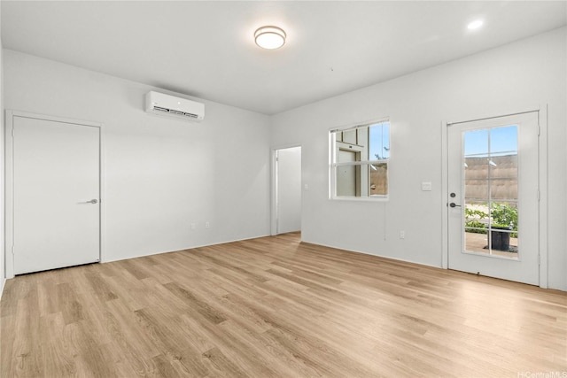91-3575 Iwikuamoo St Unit 501, Ewa Beach, HI 96706 - unfurnished room featuring a wall unit AC and light wood-style flooring