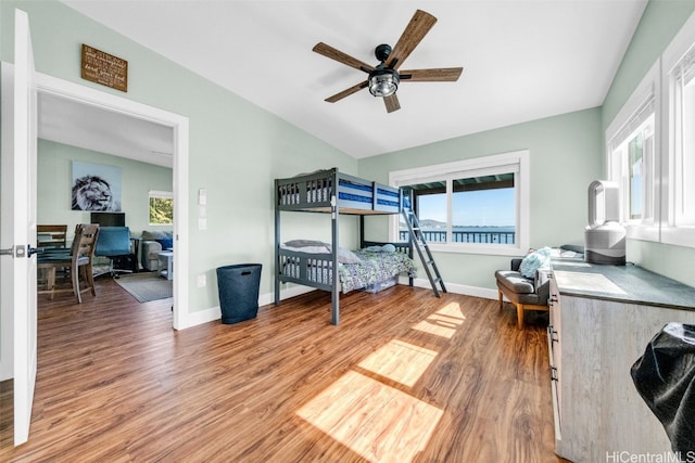 bedroom with ceiling fan and wood-type flooring