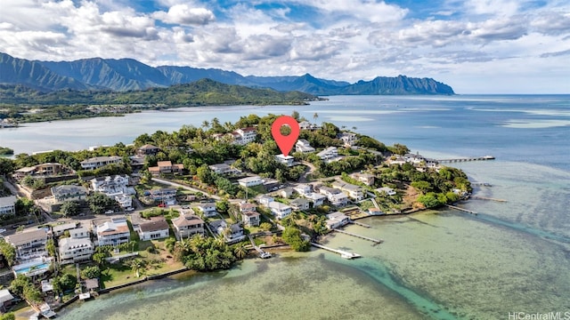 birds eye view of property featuring a water and mountain view