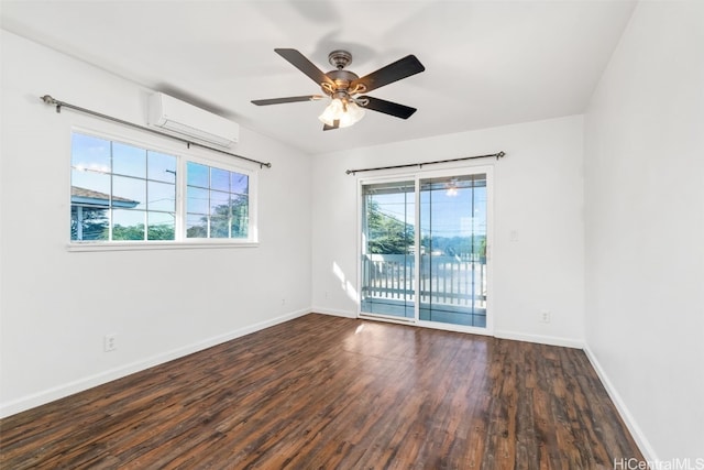 spare room featuring a wall mounted AC, ceiling fan, dark hardwood / wood-style flooring, and a healthy amount of sunlight