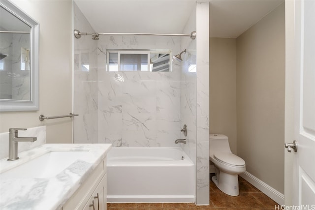 full bathroom featuring tile patterned flooring, vanity, toilet, and tiled shower / bath combo