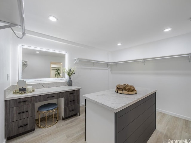 spacious closet featuring light hardwood / wood-style flooring