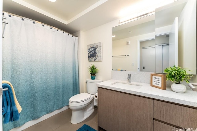 bathroom featuring tile patterned floors, vanity, and toilet