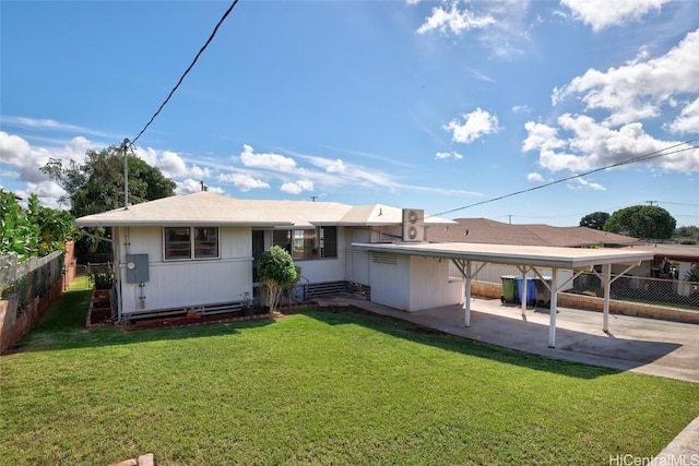 rear view of house with a yard