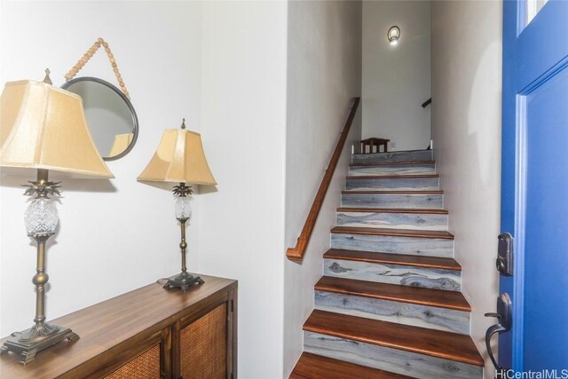 stairs with hardwood / wood-style floors