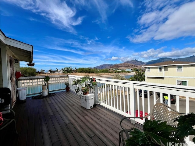 wooden deck with a mountain view