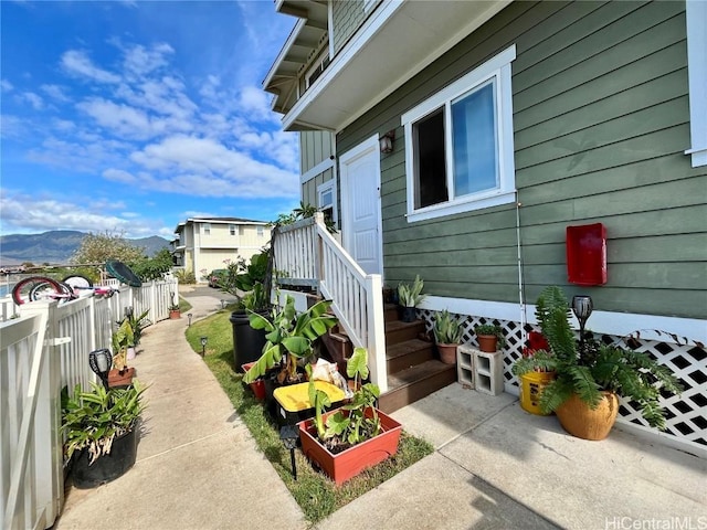 view of side of home featuring a mountain view