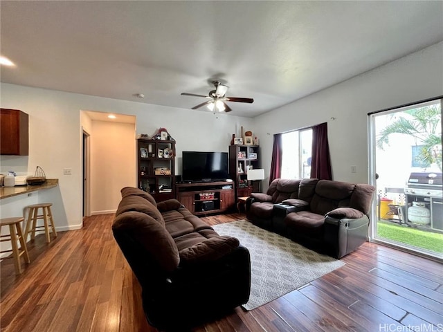 living room with hardwood / wood-style floors and ceiling fan