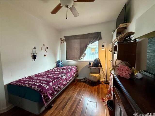 bedroom featuring ceiling fan and hardwood / wood-style flooring